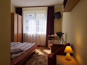 Postel nebo postele na pokoji v ubytování Willa Magdalena
