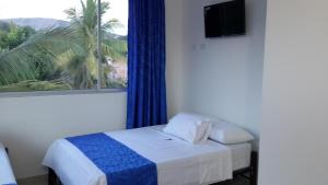 Ένα ή περισσότερα κρεβάτια σε δωμάτιο στο Tropical Resort Tocaima +37 φωτογραφίες