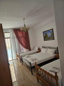 Postel nebo postele na pokoji v ubytování Vasilika rooms