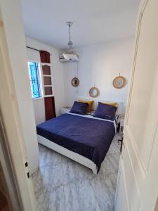 Postel nebo postele na pokoji v ubytování Maison d'été hessi Jerbi ras marmour