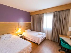Stay Inn Santos Sua acomodação com cara de Hotel客房内的一张或多张床位