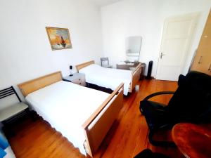 Postel nebo postele na pokoji v ubytování Ampie camere Locarno