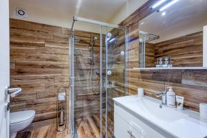 a bathroom with a shower and a sink at Apartment M- Panoramic View in Mugeba +6 photos
