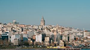 a cityscape of a city with a clock tower at The Haliç Bosphorus Hotel in Istanbul