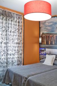 Łóżko lub łóżka w pokoju w obiekcie JC Rooms Santo Domingo