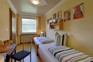 Postel nebo postele na pokoji v ubytování Appartement mit Kaiserblick