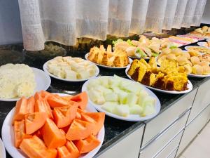 a buffet of different types of food on a table at Hotel Radan in Luís Eduardo Magalhães