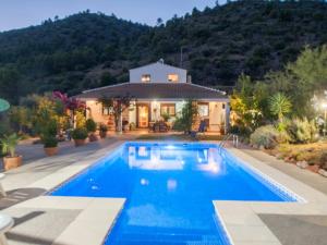 a house with a swimming pool in front of a house at Comfortable Villa in Algodonales with Private Pool in Algodonales
