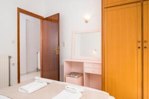 Postel nebo postele na pokoji v ubytování Captain Michalis Apartments - 750m from Kalamaki Beach + 37 fotografií