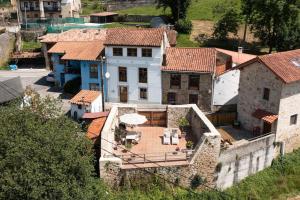 an aerial view of a house in a village at La Casona de Obdulia in Tresgrandas
