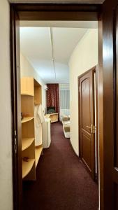 a room with a door open to a room with a roomswersswersswersswers at Hotel Zhambyl in Taraz