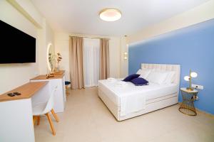 Posteľ alebo postele v izbe v ubytovaní Hotel Ilion