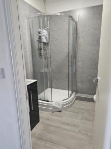 a shower with a glass door in a bathroom at The New Brighton Hotel in New Brighton +37 photos