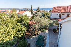 an aerial view of a house with trees at Apartment Surfer's lodge, nature driven with Sauna in Krk