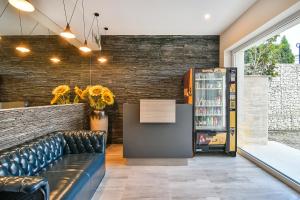 a bar with a couch and a refrigerator at Sea lounge in Varna City