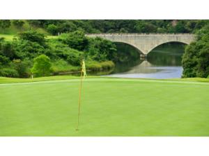 a golf course with a bridge in the background at Nanki Shirahama Resort Hotel - Vacation STAY 38054v in Asso +16 photos