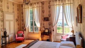 Postel nebo postele na pokoji v ubytování Château des Charmes