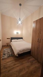 Ένα ή περισσότερα κρεβάτια σε δωμάτιο στο Piața Unirii - Yulia`s Ultra-Central Retreat