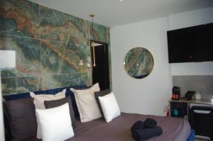 a bedroom with a bed with a map on the wall at chambre villa 4 in Servas