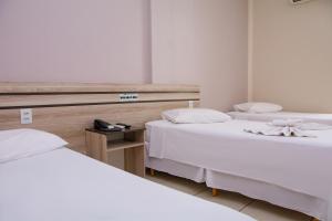 Ένα ή περισσότερα κρεβάτια σε δωμάτιο στο Hotel Mundial +26 φωτογραφίες
