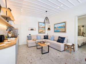 a living room with a couch and a table at Apaggio Boutique House in Andros
