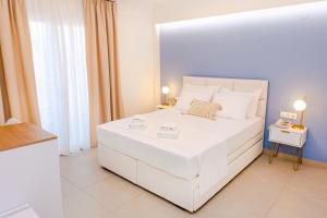 Posteľ alebo postele v izbe v ubytovaní Hotel Ilion