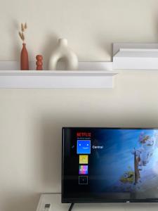 TV a/nebo společenská místnost v ubytování Central