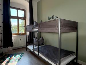 two bunk beds in a room with a window at Ferienwohnung Plohn by Immo-Franzi in Lengenfeld
