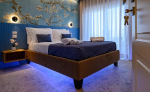 a bedroom with a large bed with towels on it at Exclusive B&B in Pizzo