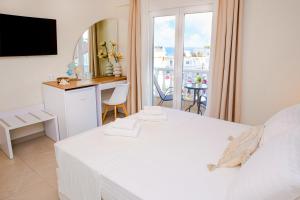 Posteľ alebo postele v izbe v ubytovaní Hotel Ilion