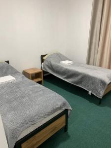 Postel nebo postele na pokoji v ubytování Гостевой дом ORDO