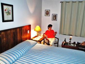 Cama ou camas em um quarto em Pousada Arboretum