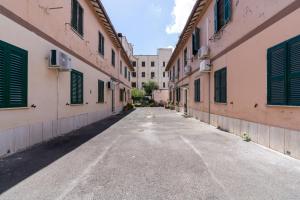 an empty street in an alley between two buildings at Ciampino-Roma - Modern Apartment-Airport & Station in Ciampino