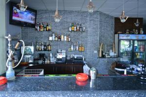 a bar in a restaurant with a brick wall at Travel Inn Hotel Simpson Bay in Simpson Bay