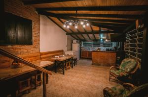 a kitchen and dining room with a table and chairs at Lago 7 Cores in Tapiraí +117 photos
