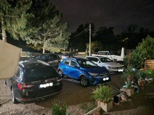 a group of cars parked in a parking lot at Haus Natura in Jurdani