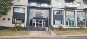 a building with a sign on the front of it at Rincon del Sol in Pinamar