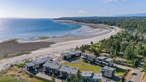 an aerial view of a house next to a beach at Ocean View Townhouse #27 in Oyster Bay +43 photos