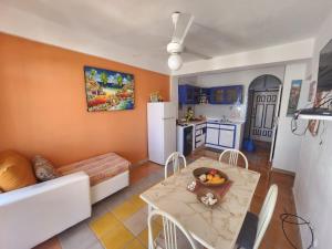 a living room with a table and a kitchen at El Castillo Dominicus in La Laguna +16 photos