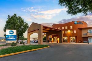 a hotel with a best western sign in front of a building at Best Western Kiva Inn in Fort Collins