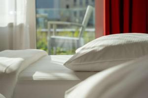 Krevet ili kreveti u jedinici u okviru objekta Park Inn by Radisson Linz
