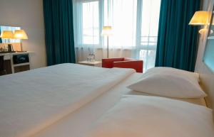 Krevet ili kreveti u jedinici u okviru objekta Park Inn by Radisson Linz