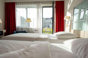 Krevet ili kreveti u jedinici u okviru objekta Park Inn by Radisson Linz