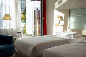 Krevet ili kreveti u jedinici u okviru objekta Park Inn by Radisson Linz