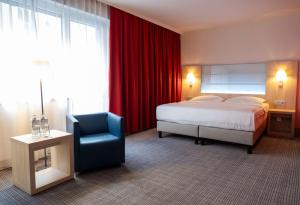 Krevet ili kreveti u jedinici u okviru objekta Park Inn by Radisson Linz