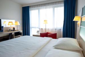Krevet ili kreveti u jedinici u okviru objekta Park Inn by Radisson Linz