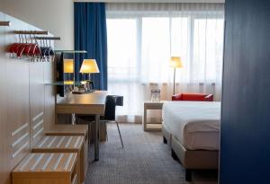 Krevet ili kreveti u jedinici u okviru objekta Park Inn by Radisson Linz