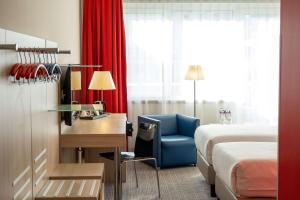 Krevet ili kreveti u jedinici u okviru objekta Park Inn by Radisson Linz