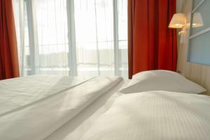 Krevet ili kreveti u jedinici u okviru objekta Park Inn by Radisson Linz