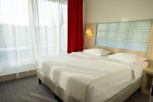 Krevet ili kreveti u jedinici u okviru objekta Park Inn by Radisson Linz